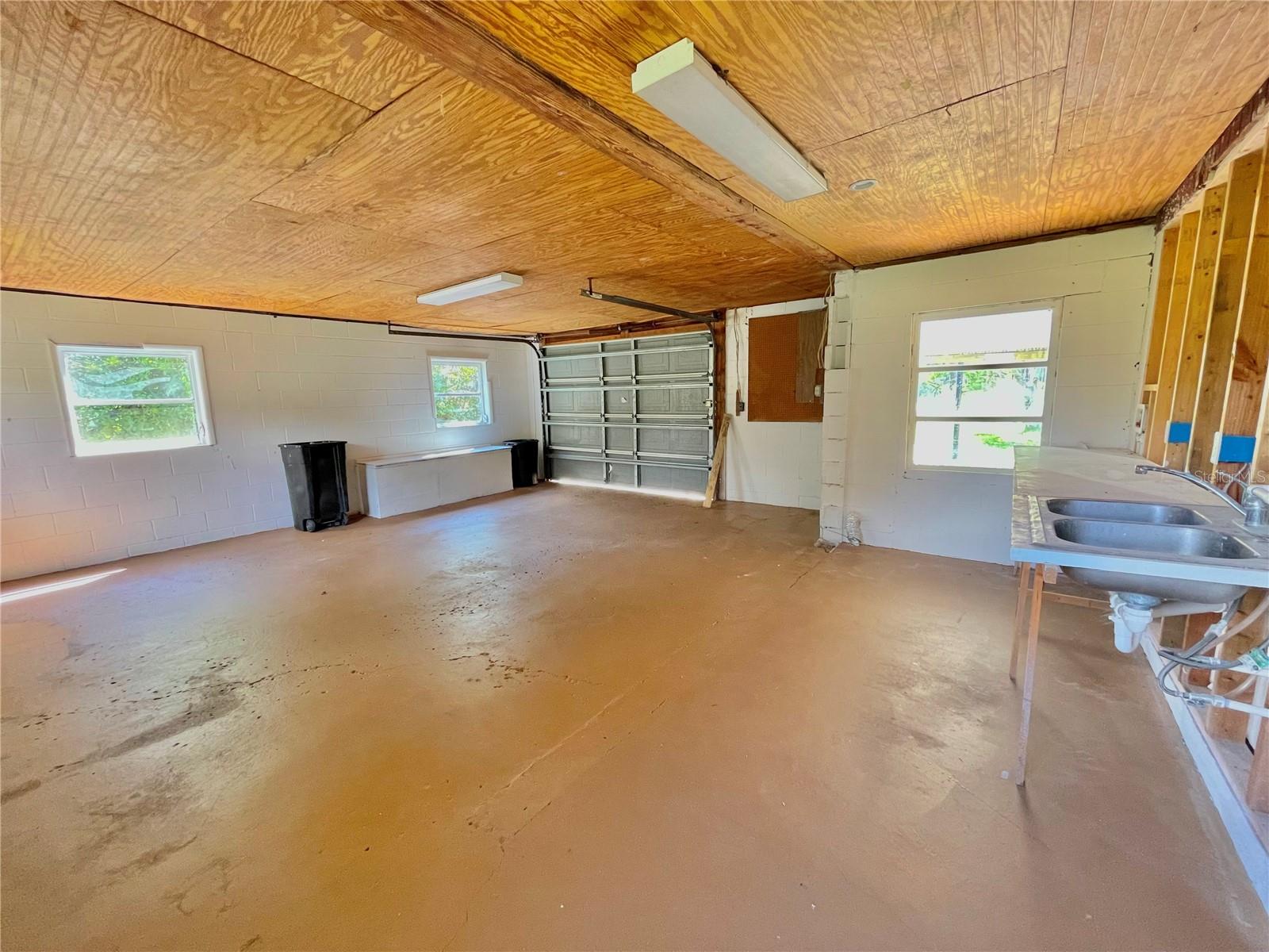 The extended garage has been cleaned out and painted.