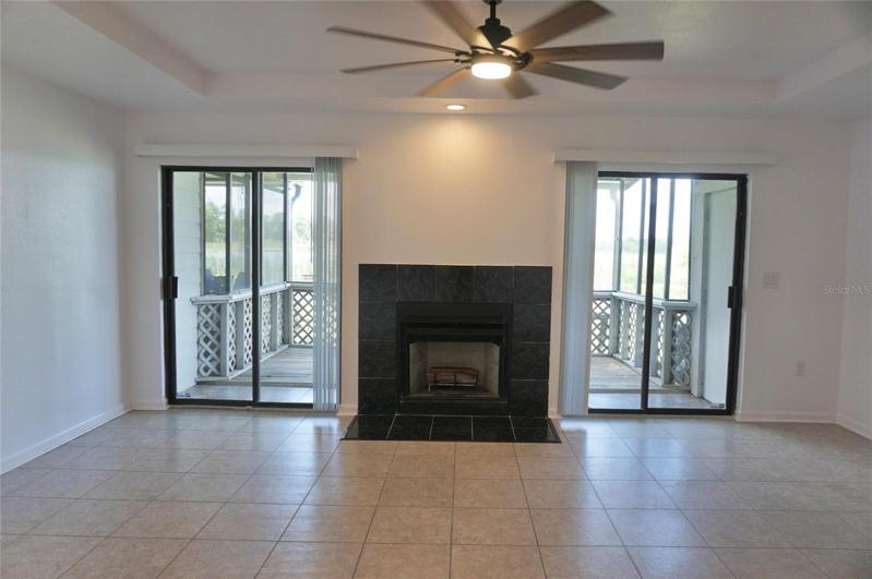 Decorative fireplace with 2 access points to the patio