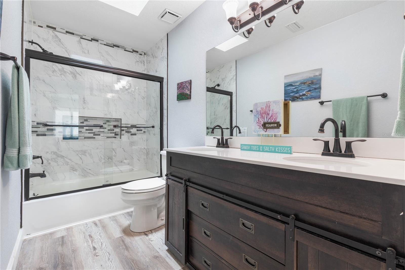 3rd full bath complete with Sky-Light
