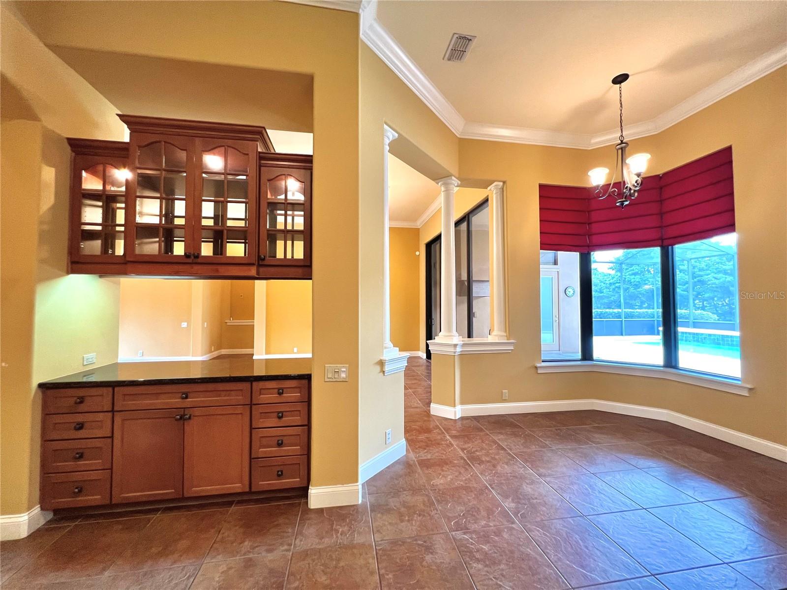 Breakfast nook overlooking pool &amp; patio