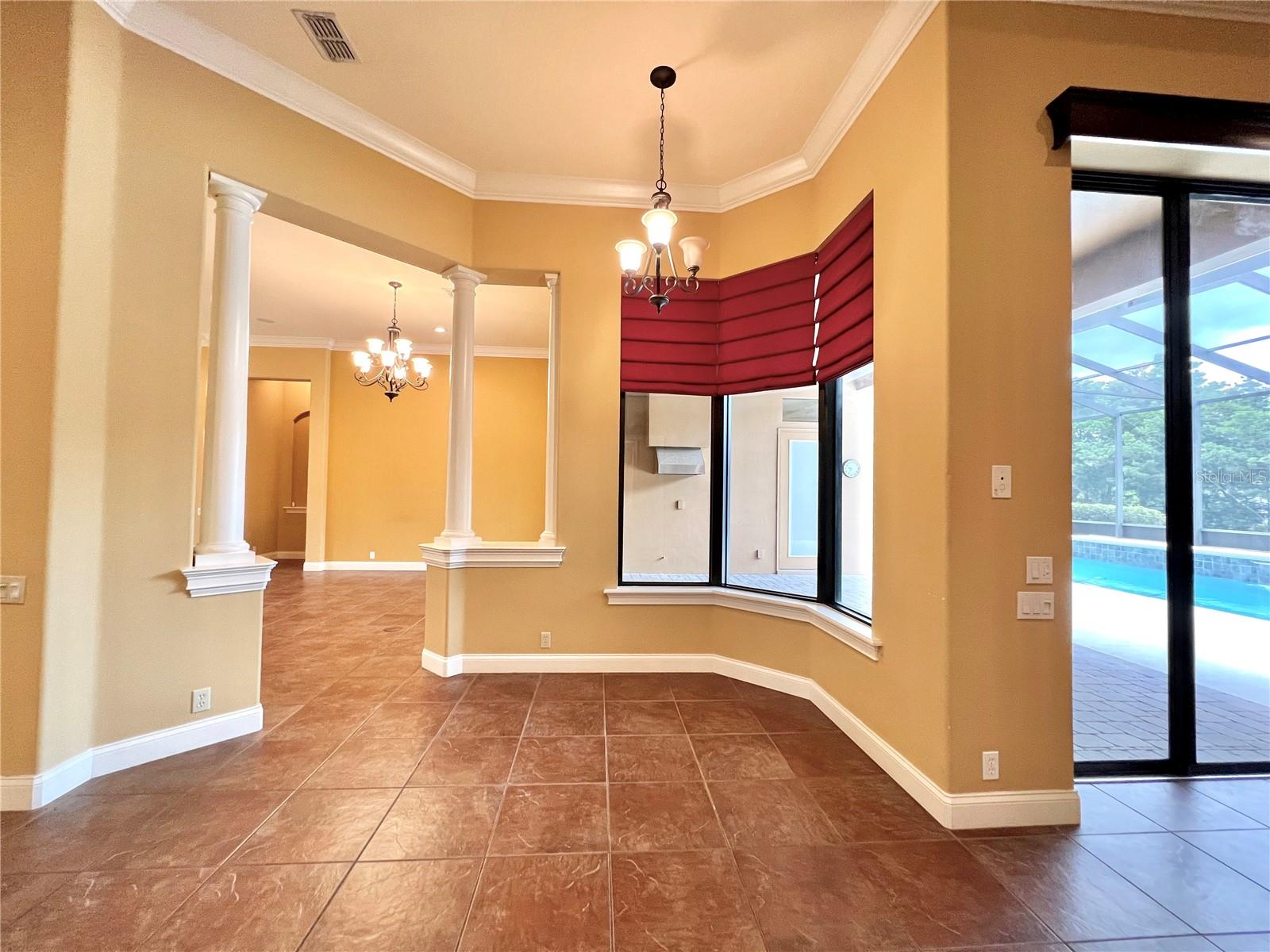 breakfast nook overlooking pool &amp; patio area