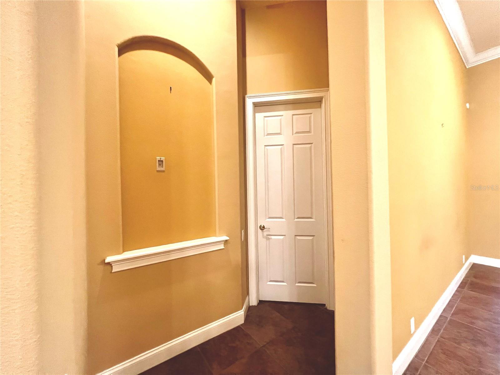 Entrance to master suite area w/ ornate niche