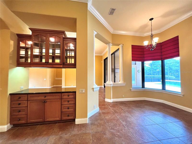 Breakfast nook overlooking pool & patio
