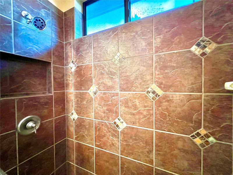 3rd bathroom has nicely tiled shower