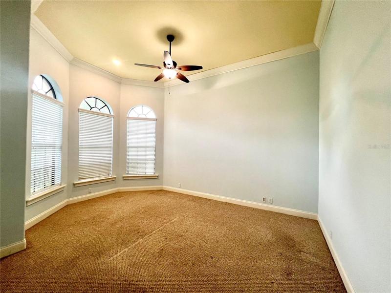 office w/ high ceiling & pretty bay window