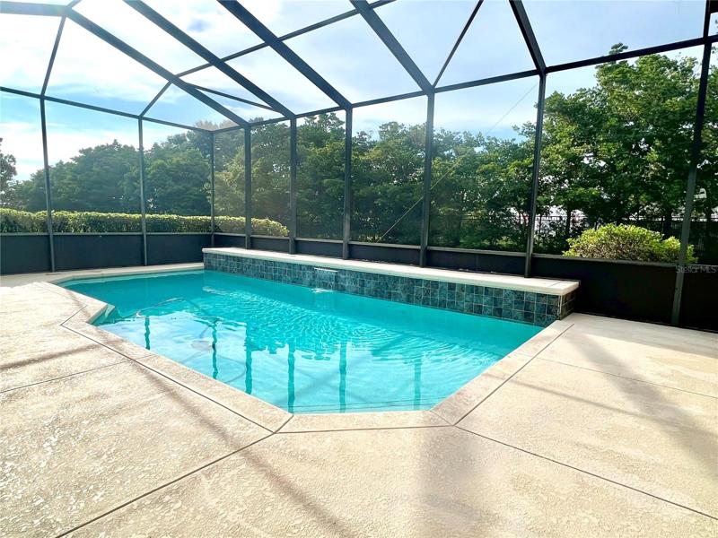 Lovely screened pool w/ waterfall feature
