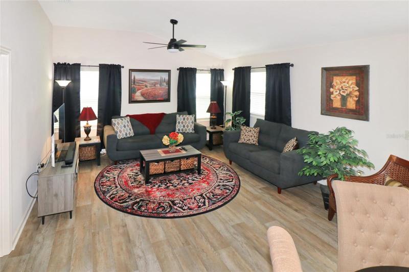 Furniture in this living room stays with the home.  Rug stays, too.