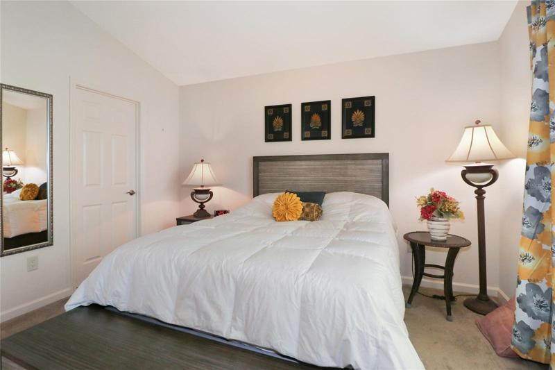 Queen bed and furntiure stays except cabinet in corner .