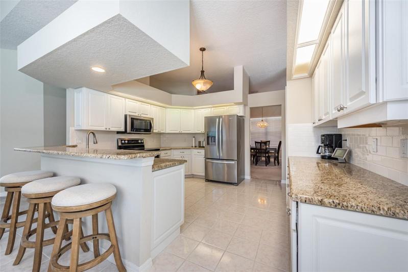Who wouldn't love the granite counters, breakfast bar, and stainless steel appliances plus lots of working room and cabinets.