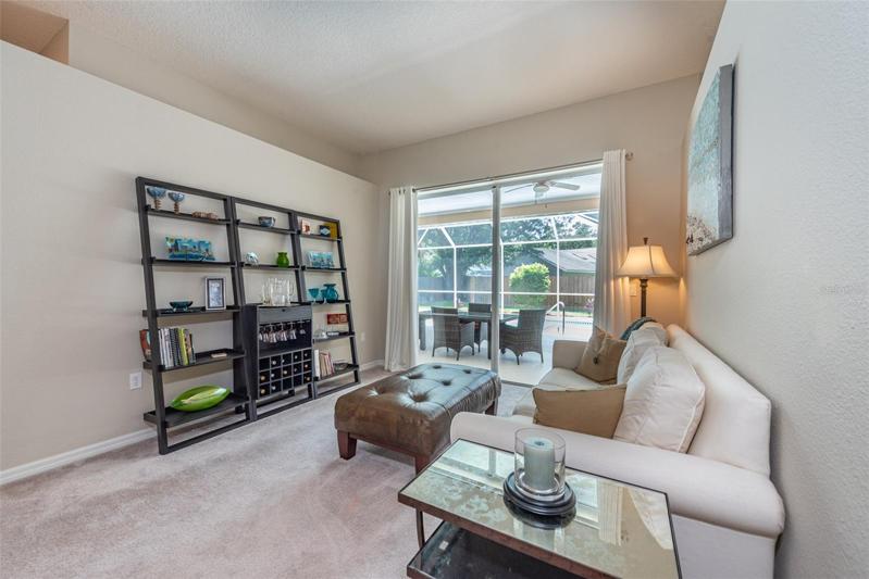 Formal living room with plant shelves.