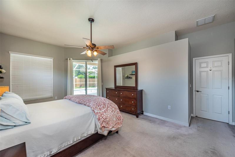 Notice the slider out to the pool area from the master bedroom.
