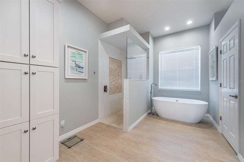Notice the modern walk in shower.