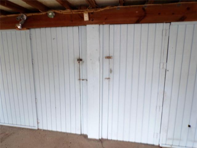 BASE LEVEL ONE OF TWO ENTRANCES  TO A THIRD BATH,WORKSHOP,LAUNDRY AND GAME ROOM