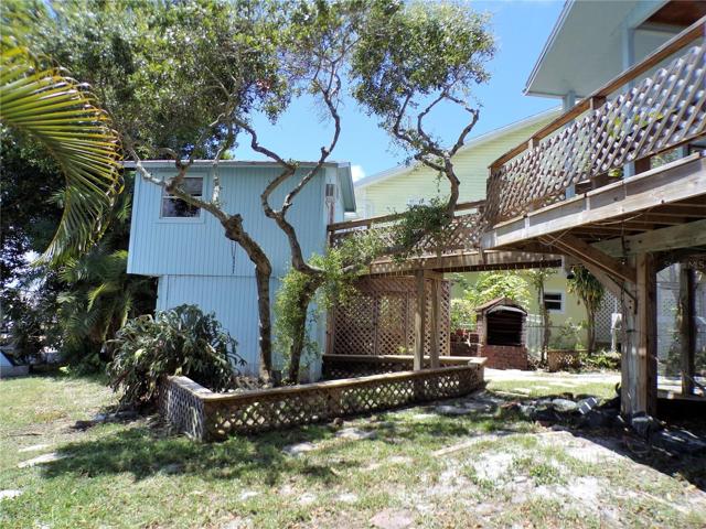 VIEW OF OUT BUILDING WITH WALKWAY CONNECTED TO HOME