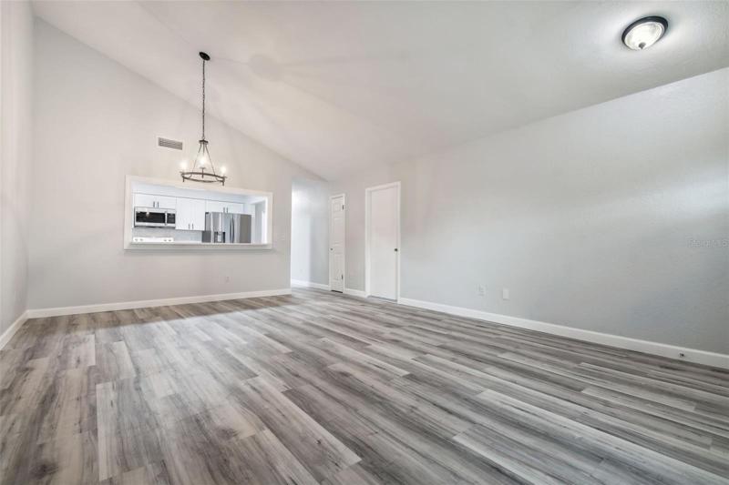 Large open living room dining room combo.