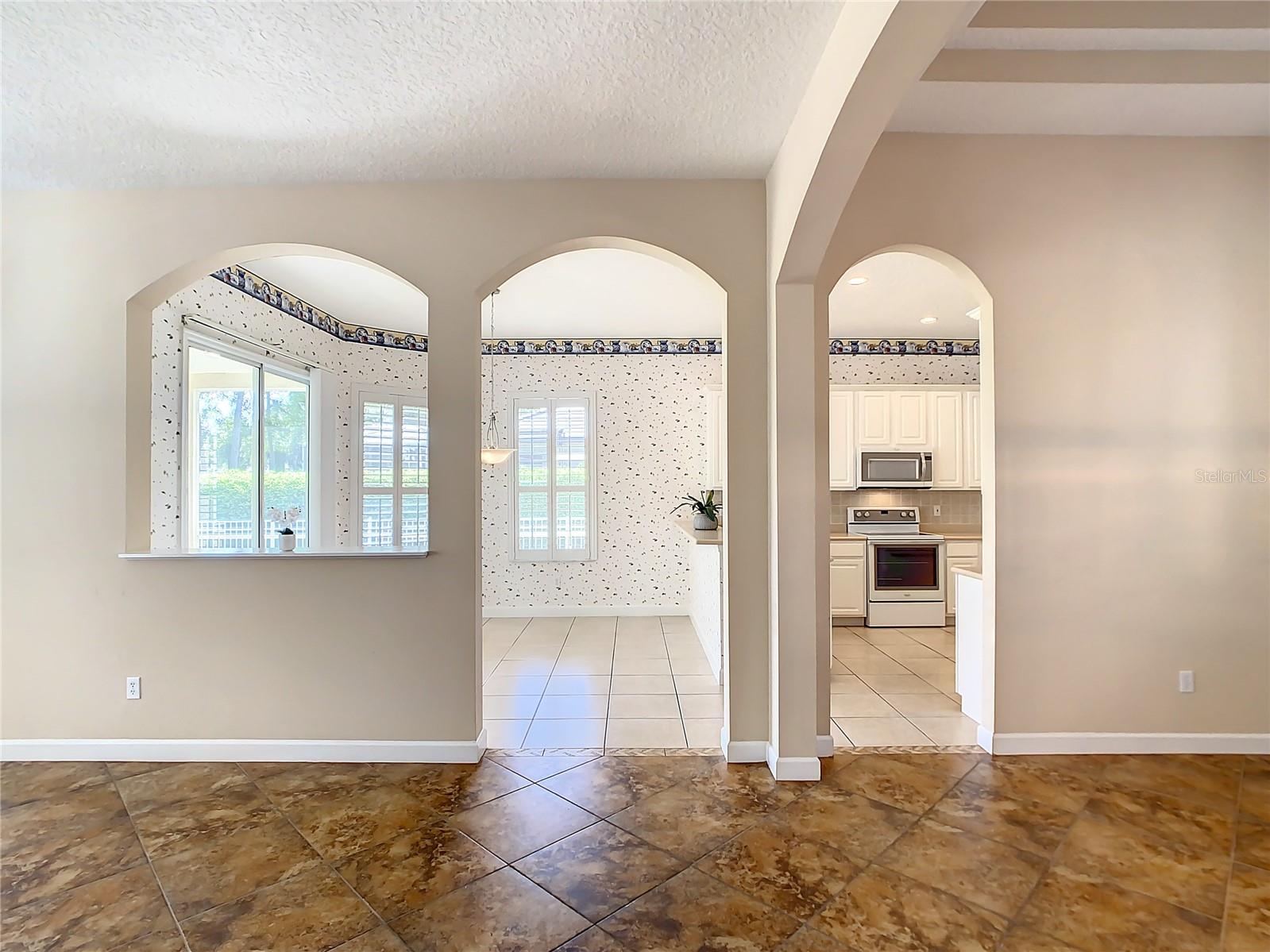 View into kitchen and kitchen eat-in area