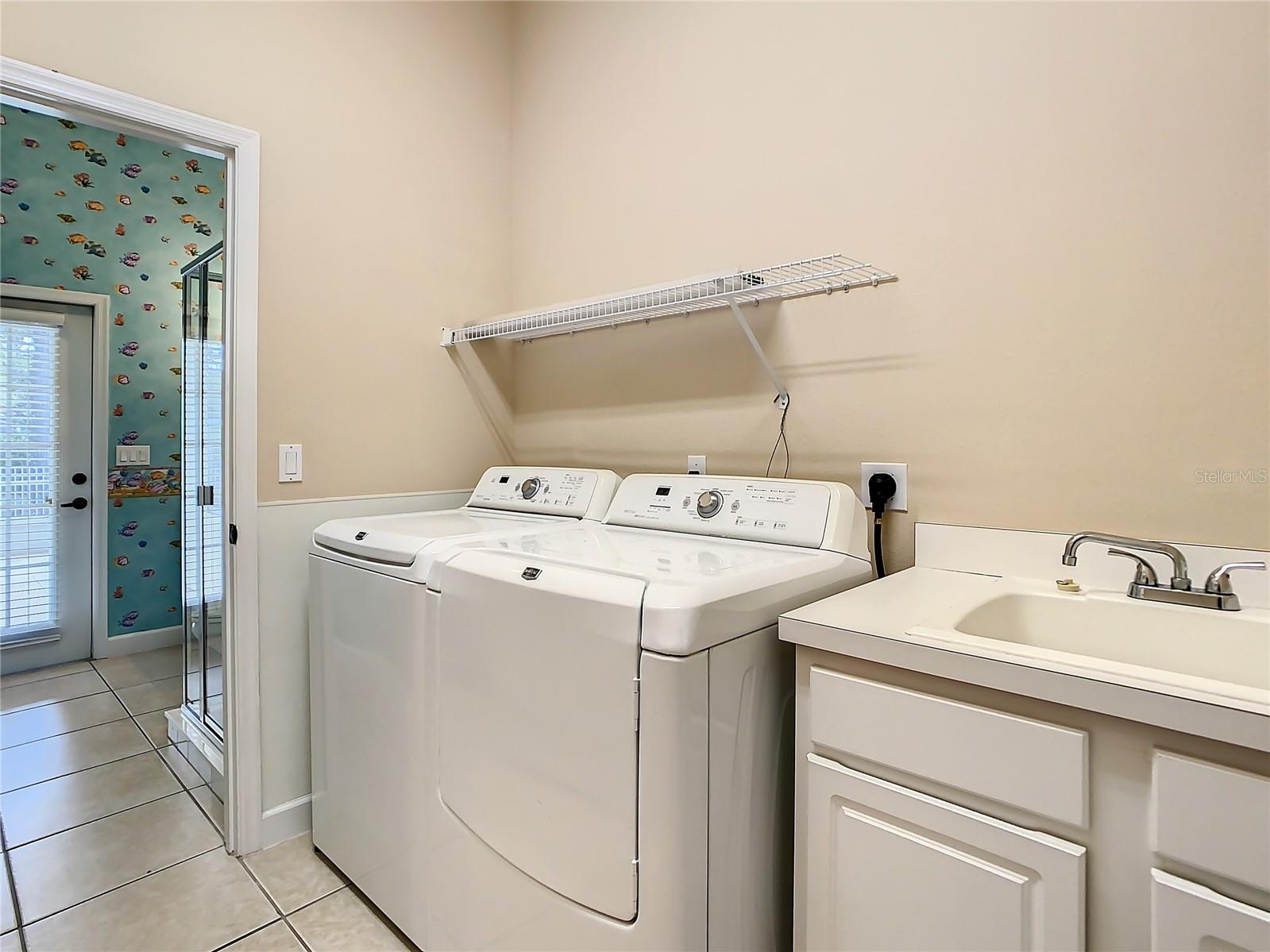 View of full bath from laundry