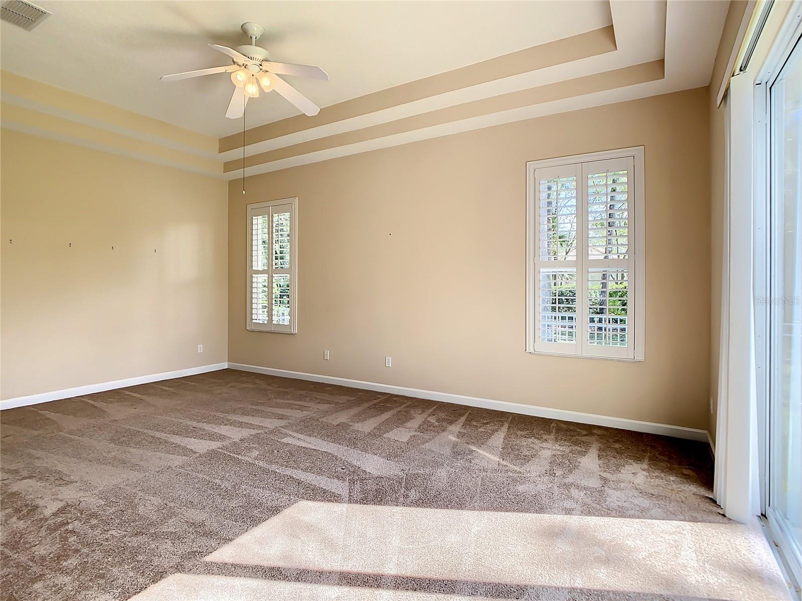 Master bedroom with coffered ceilings