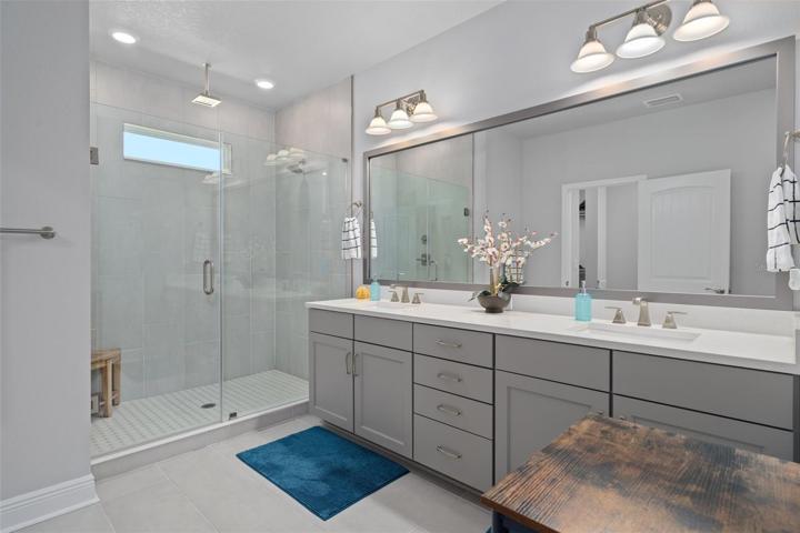 Owner's bathroom w overhead rain shower and dual sinks