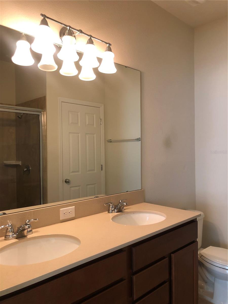 Master Bathroom with Double Sink and Shower