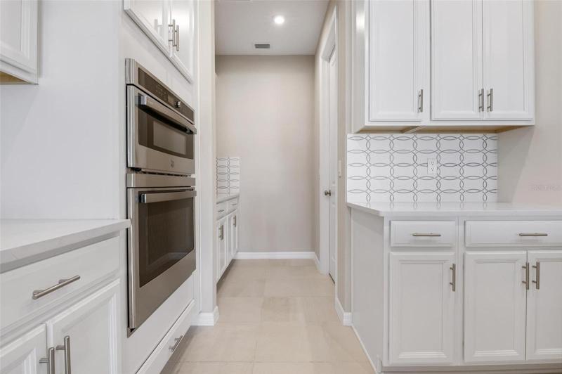Kitchen has pantry behind