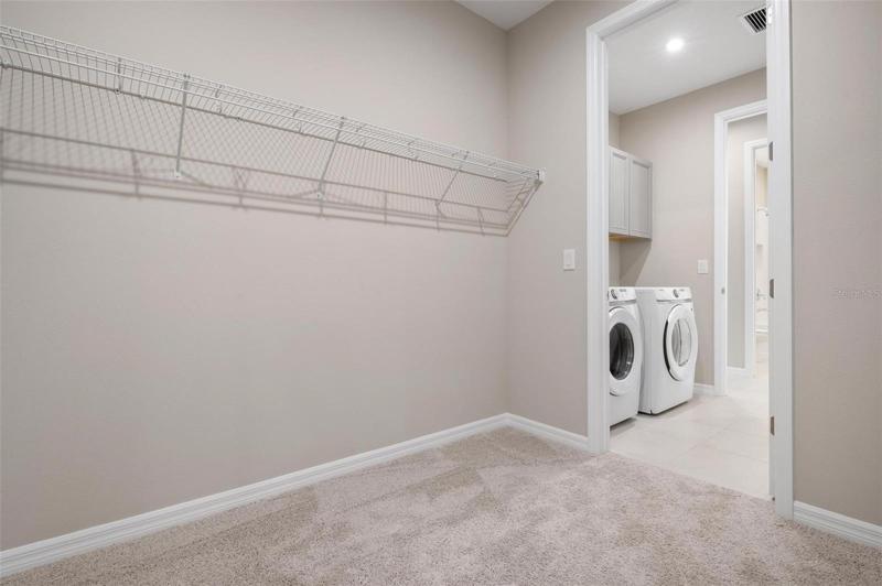 master closet is attached to laundry room
