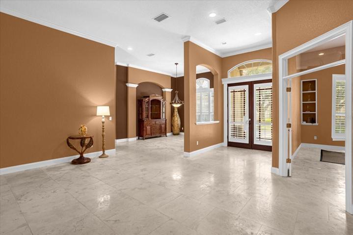 Living room looking towards dining room, office on right