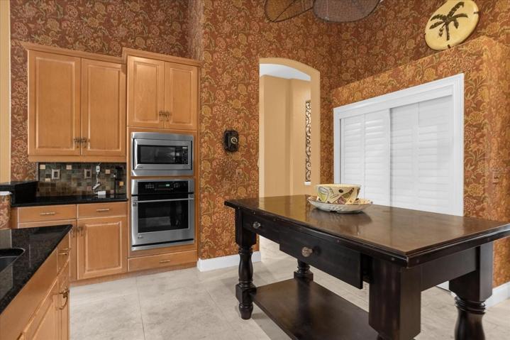 Kitchen, hallway leads to bedrooms 2 - 4, dining and living rooms to right
