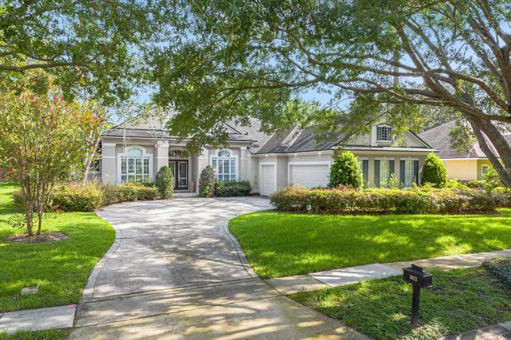 Front of house with three car garage
