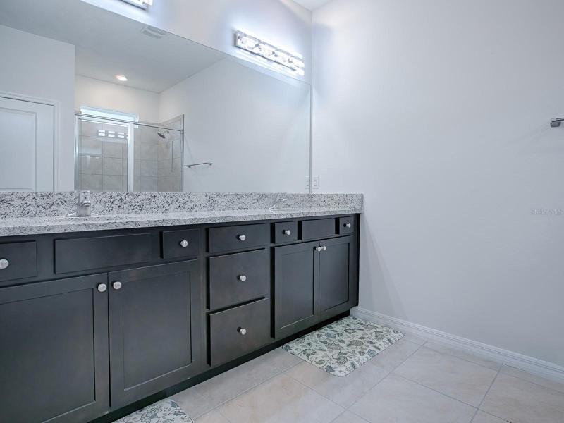 MASTER BATH HAS DUAL SINKS AND PLENTY OF CABINETS