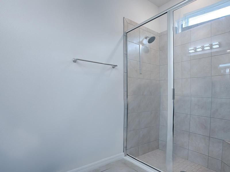 BEAUTIFUL TILE IN THE SPACIOUS WALK-IN SHOWER