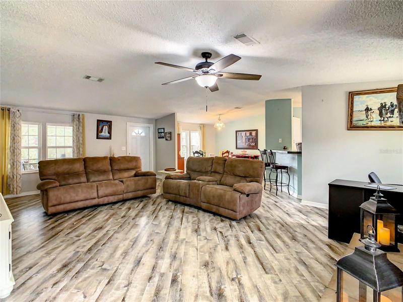 Living Room with View of Dining Room & Kitchen