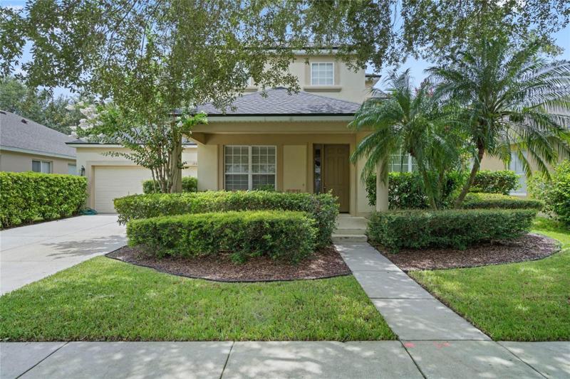Front of home with mature landscaping