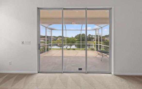 Family room looking out sliding glass doors