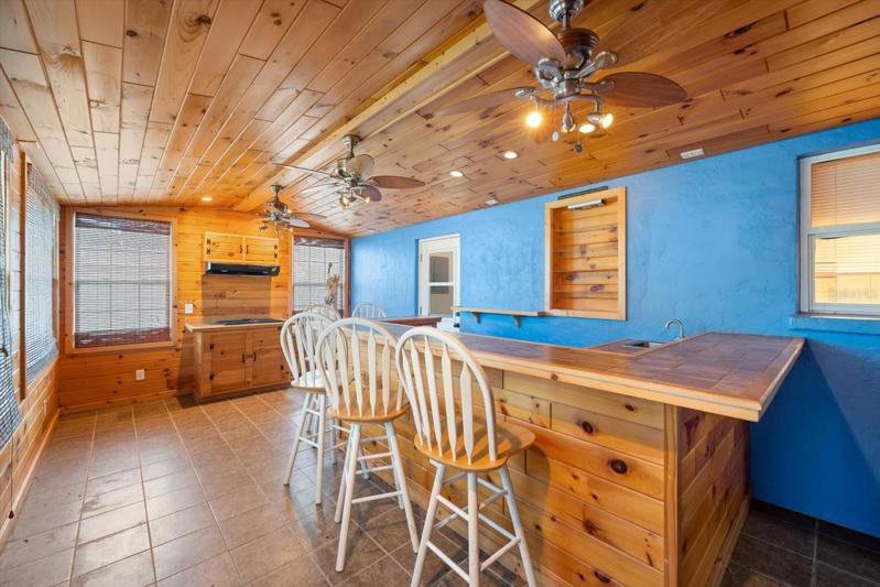 Bar room with wet bar & Jenn Air grill