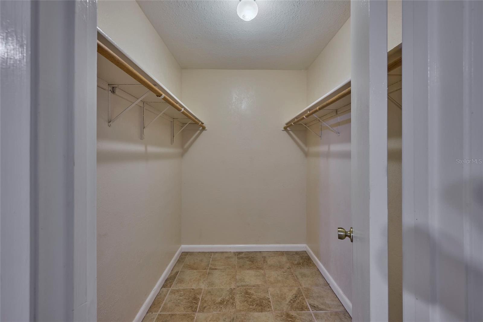 Back guest bedroom walk in closet is LARGE