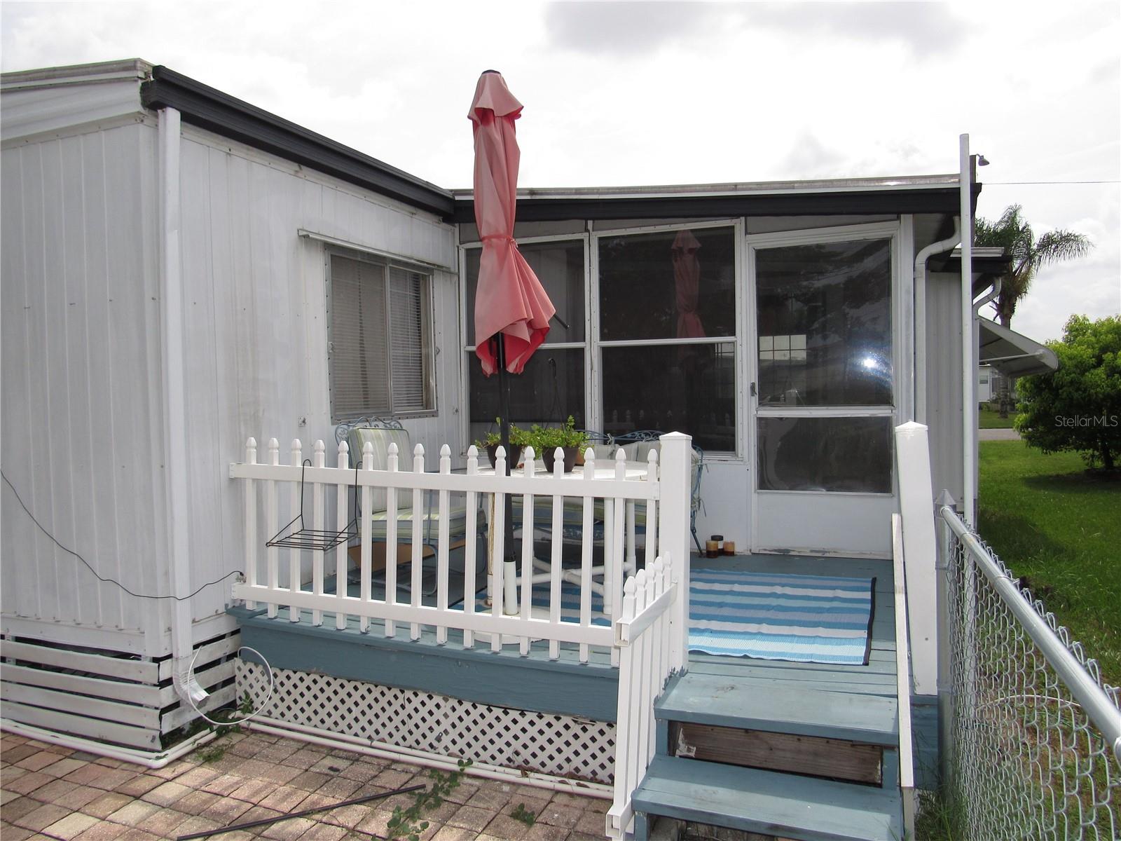 Raised deck &amp; paver patio.
