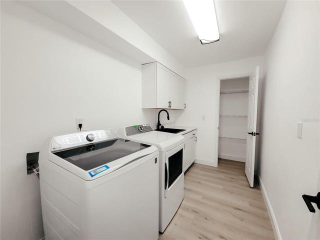 And who doesn't love a laundry room with a soaker sink, cabinetry and another closet to store supplies!  New Washer and Dryer!