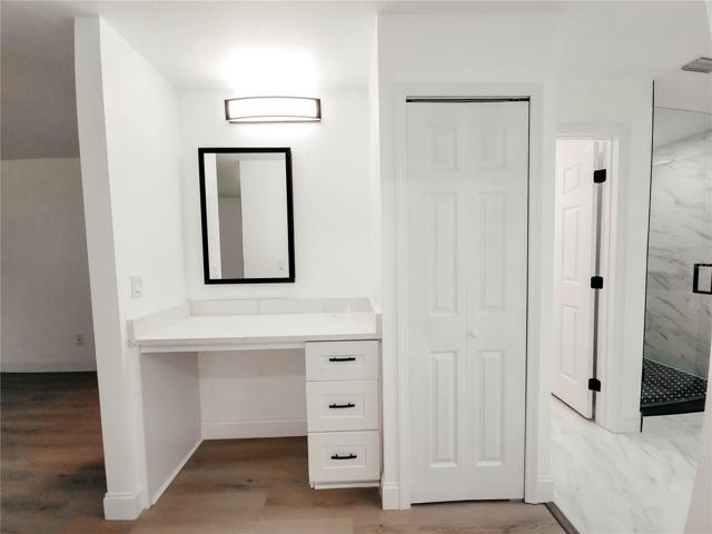 Extra Vanity with knee space for sitting and finishing your morning routine adjacent to the Master Closet