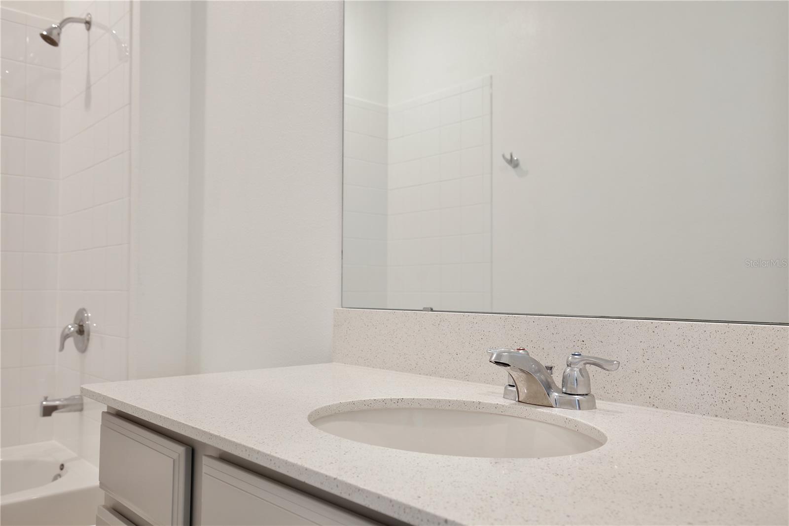 Quartz counters and soft neutral tones.