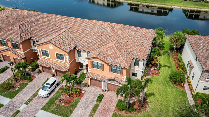 Beautiful lakefront townhome in 24 hour guard-gated Gran Paradiso!