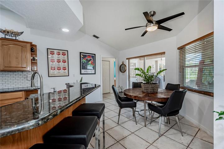 dinette area with pool access just off kitchen