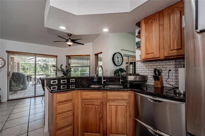 stainless appliances, breakfast bar and great pool views