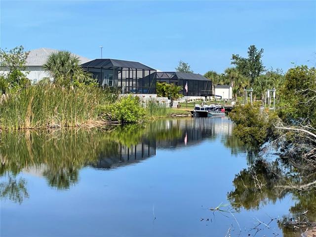 Rear of vacant lot on canal
