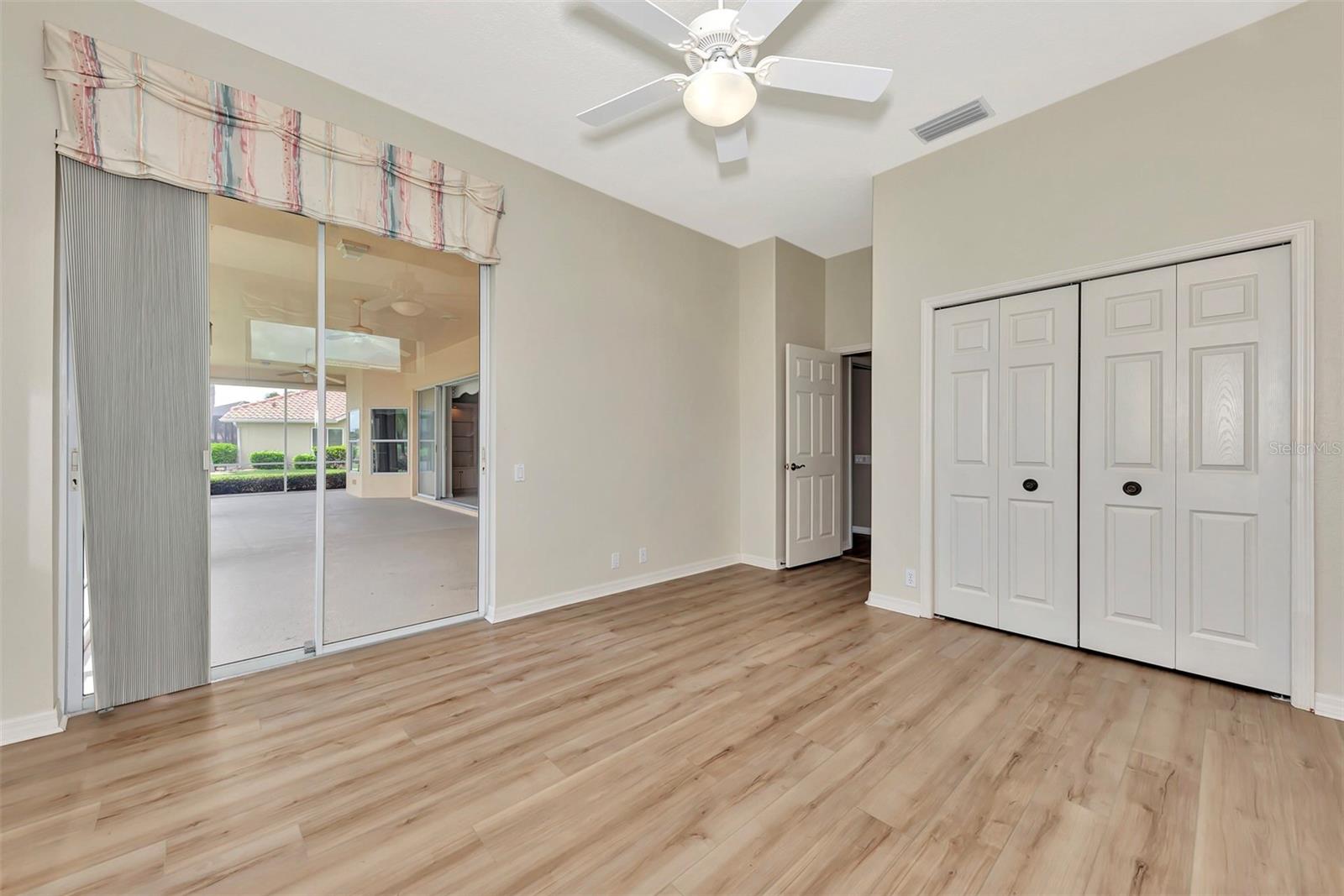 Bedroom #2 w/Luxury Vinyl Flooring & Sliders to Lanai