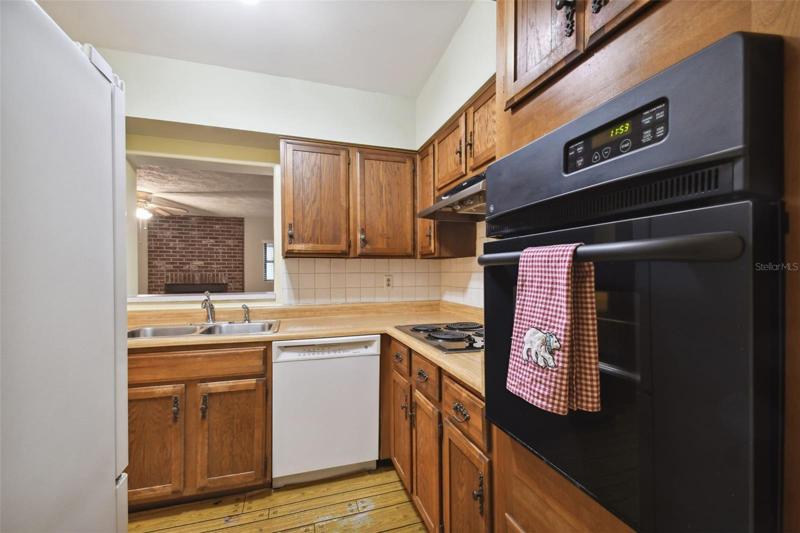 Kitchen with Pass-Thru Serving Window into the Family Room.