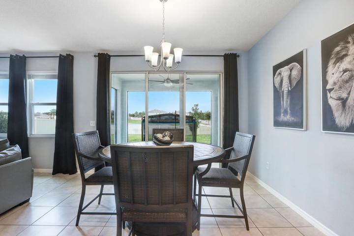 Dining room area with sliding doors to screen lanai