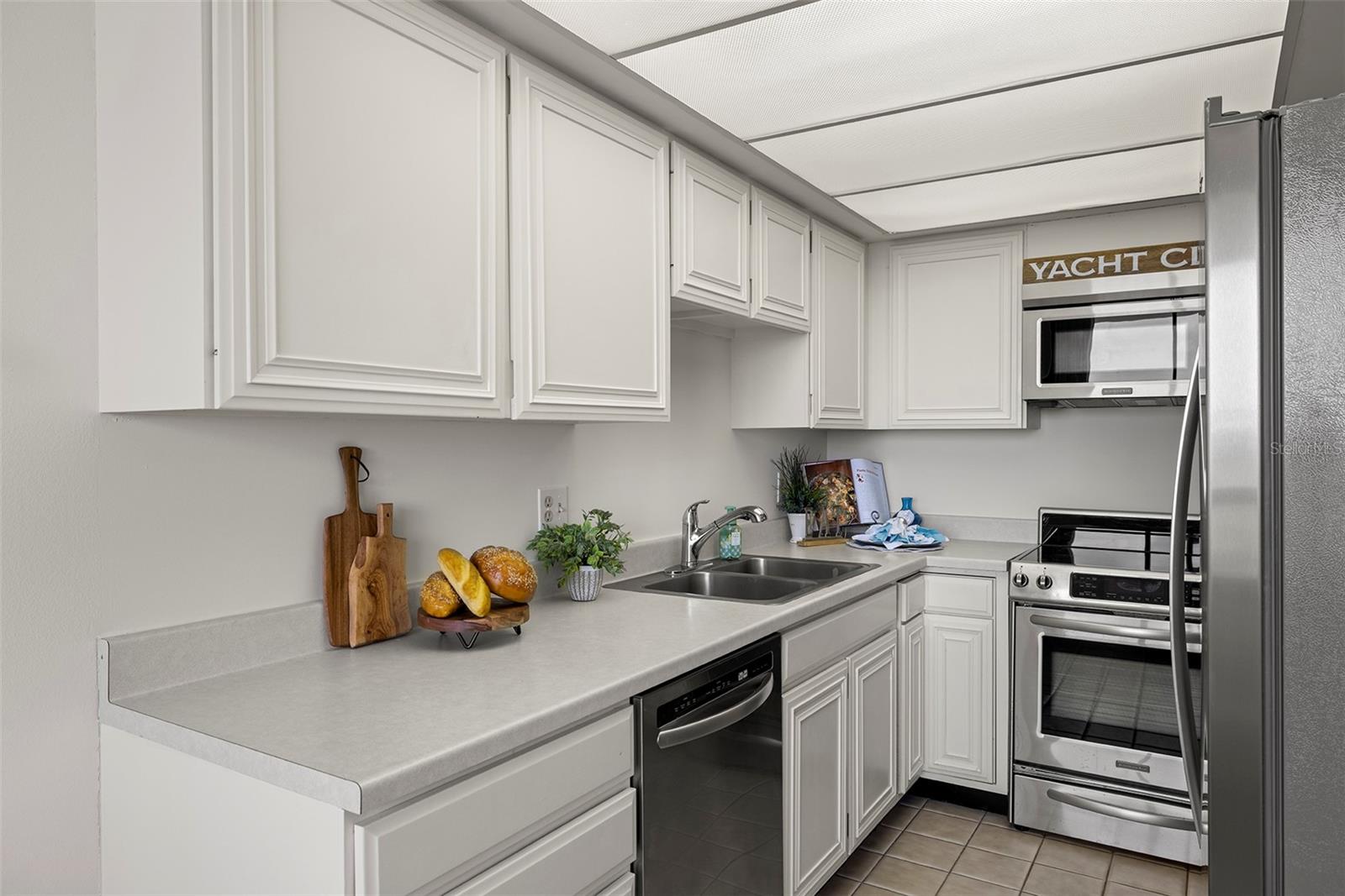 Bright white kitchen with stainless steel appliances