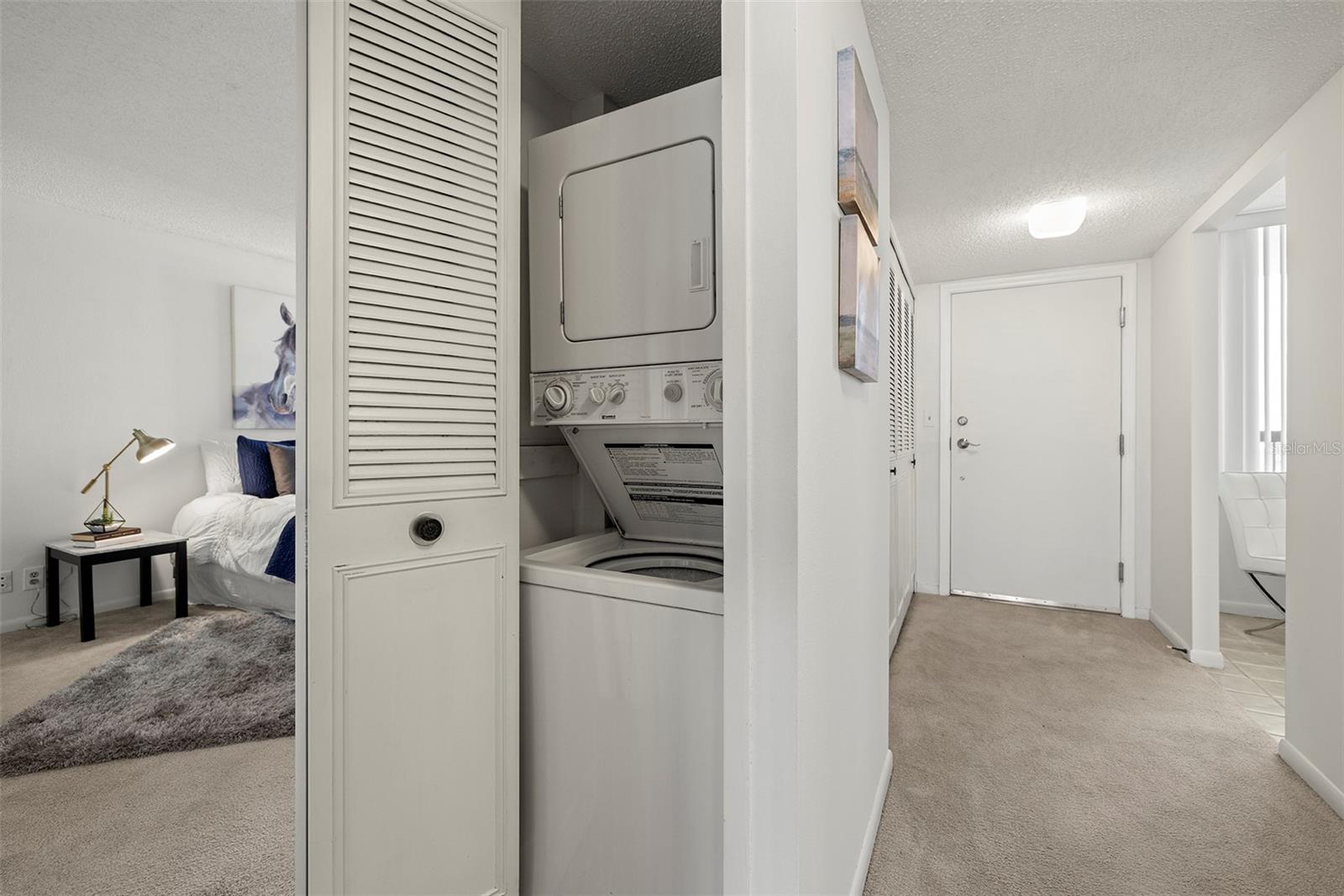 The unit also has a stacked washer and dryer that convey in the sale