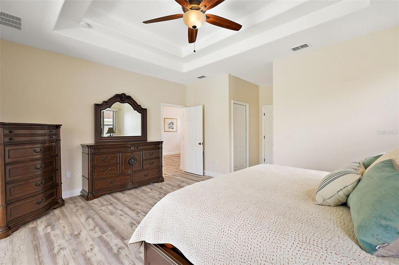 Dual Walk-In Closets w/ Built-in Shelving